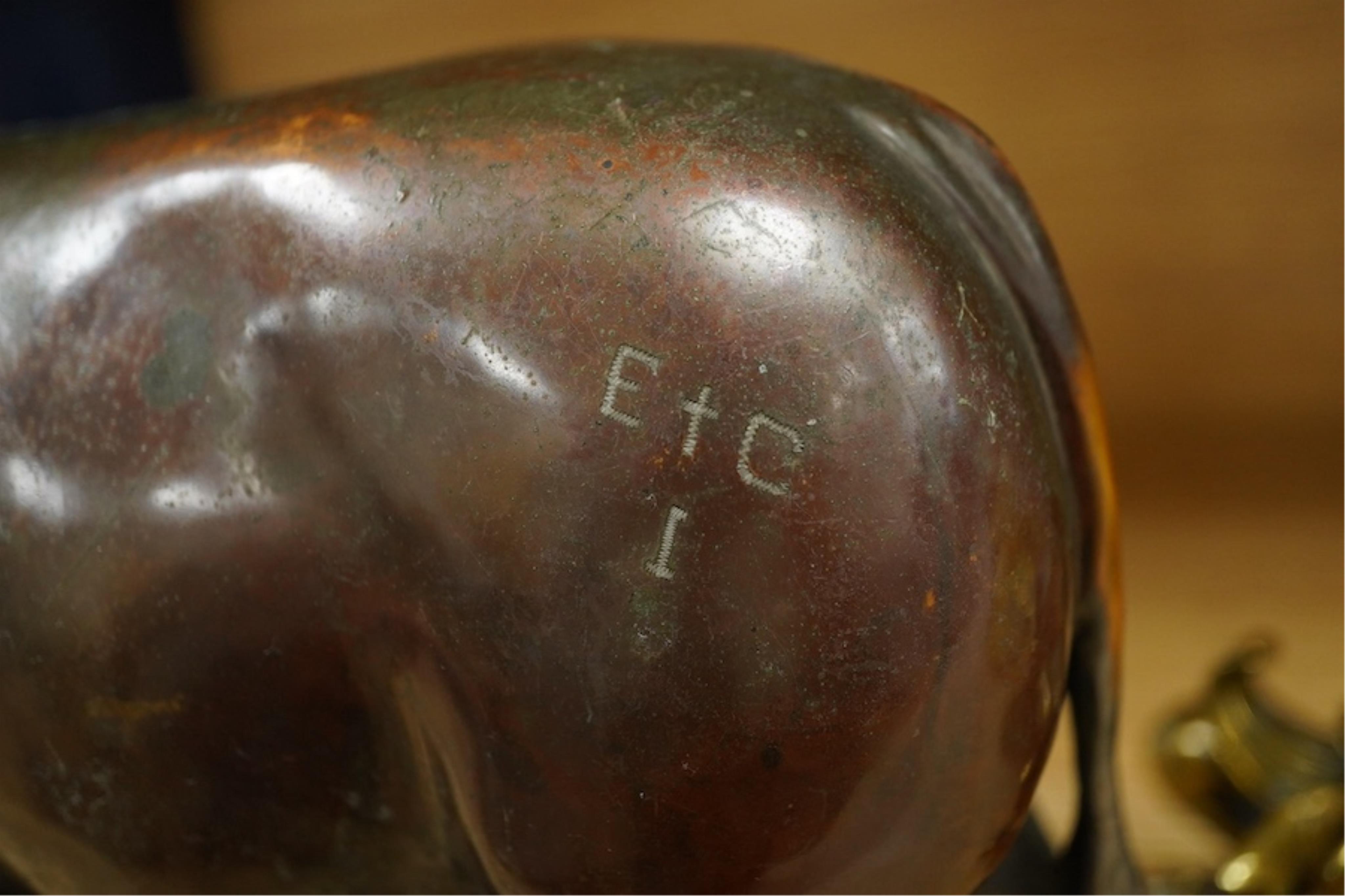 A patinated copper study, 'American Brahman', inscribed EtC, together with a pair of 19th century ormolu candlesticks, largest 30cm high. Condition - fair, bull missing one horn